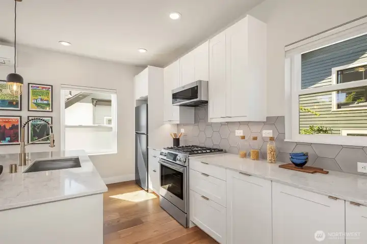 Welcoming, sleek + sophisticated designed eat in kitchen, enhanced by tons of light. Welcoming, sleek + sophisticated designed eat in kitchen, enhanced by tons of light.