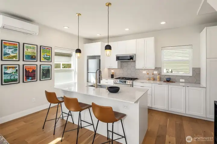 Welcoming, sleek + sophisticated designed eat in kitchen, enhanced by tons of light. Welcoming, sleek + sophisticated designed eat in kitchen, enhanced by tons of light.
