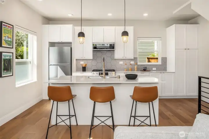 Welcoming, sleek + sophisticated designed eat in kitchen, enhanced by tons of light. Welcoming, sleek + sophisticated designed eat in kitchen, enhanced by tons of light.