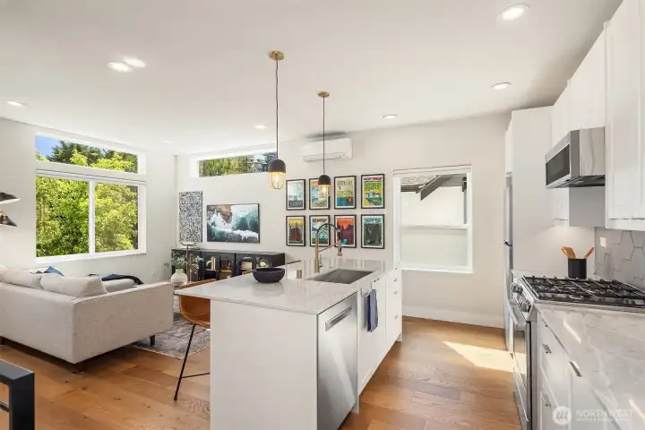 Open concept on the main floor, with the kitchen + living area combined. Open concept on the main floor, with the kitchen + living area combined.