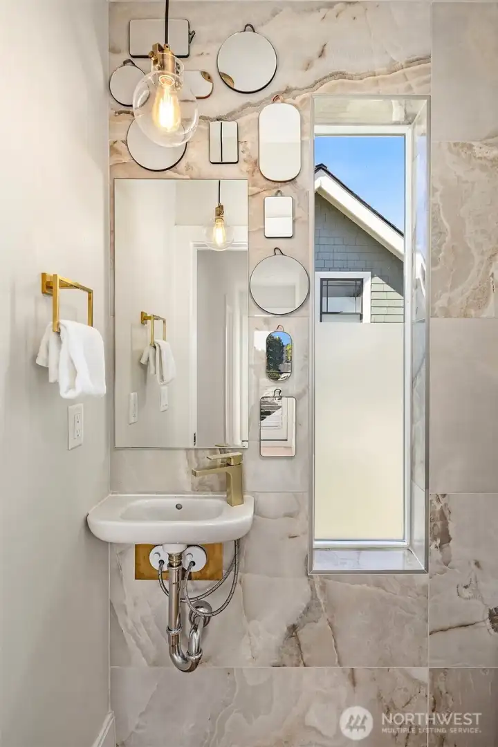 Powder room at upper level landing. Powder room at upper level landing.
