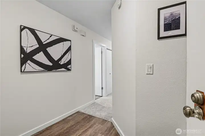 Entrance to this light-filled 2-bedroom, 1.75-bath condo, accessible from the secure lobby with elevator access. Brand new carpet and fresh paint for a move-in ready feel.