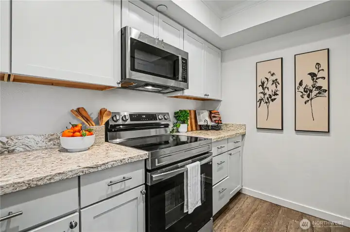 The kitchen is equipped with stainless steel appliances, combining style and functionality for all your culinary adventures.