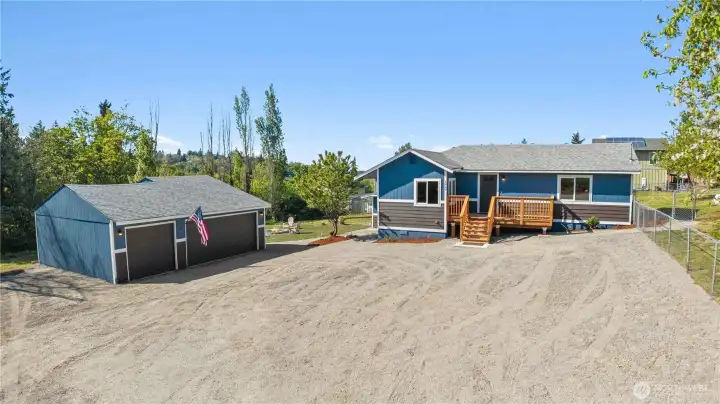 Welcome Home to this Half Acre Lot in Tacoma w/4-Bedroom Home and 3-Car Garage/Shop!