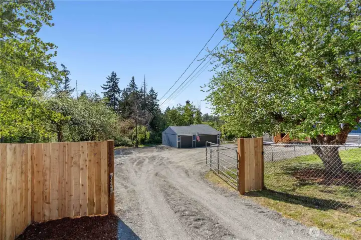 Front Gated Entrance with fresh gravel driveway.