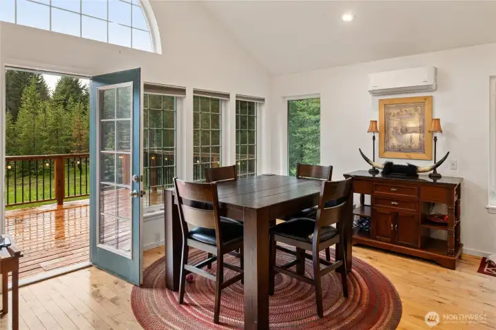 Indoor-outdoor living with direct access to expansive deck space.