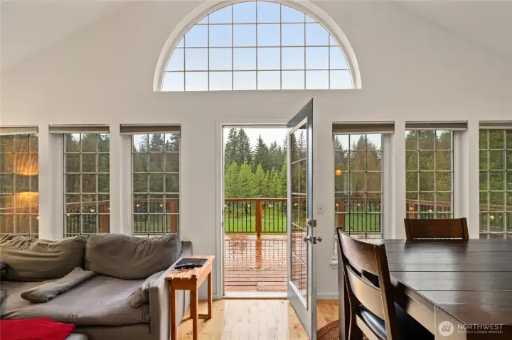 Large windows bring in natural light and forest views.