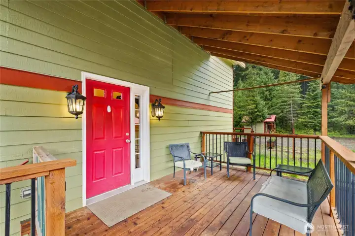 Entry door and covered outdoor space for relaxing in every season.