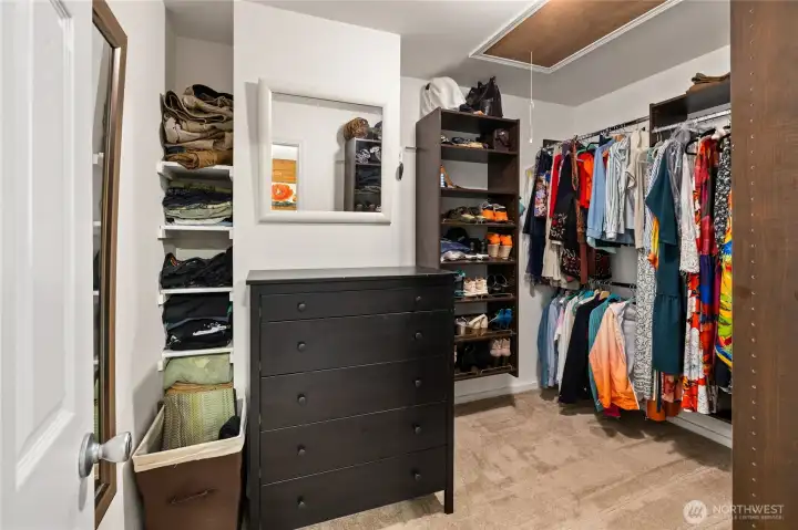 Spacious walk-in closet with built-in organization.