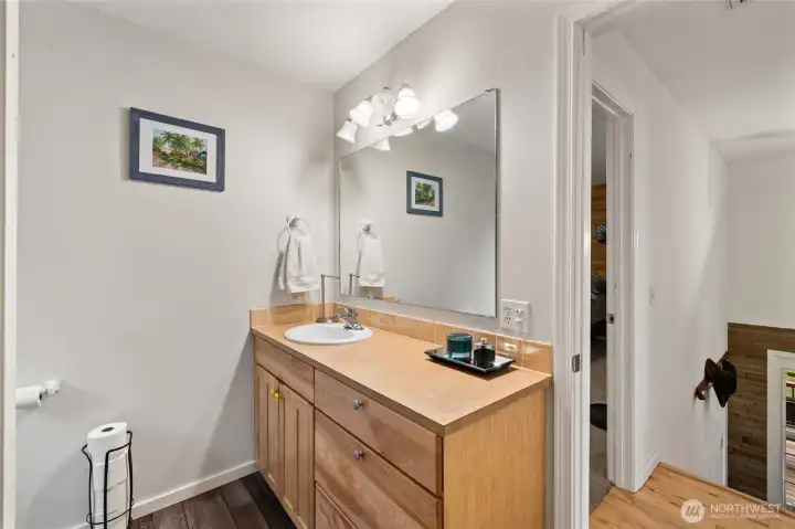 Updated bathroom with function al layout and storage.