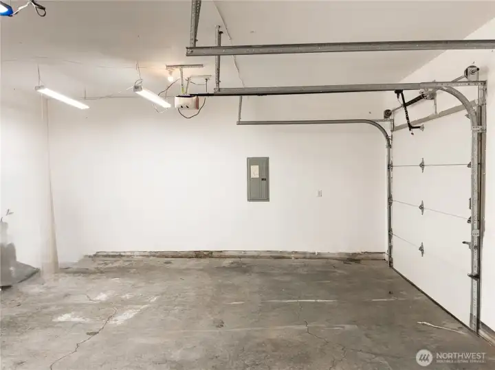 Attached two car garage provides everyday convenience.  Sheetrock, painted and well lit.