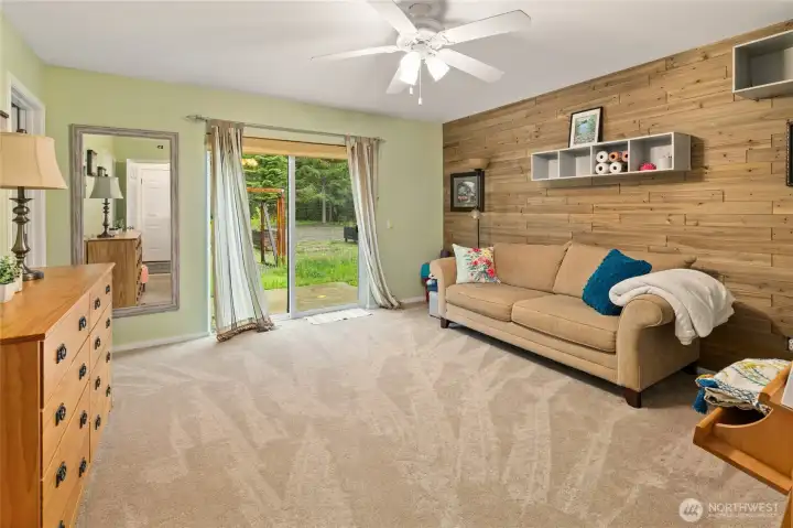 Sliding doors opens directly to a private patio space.