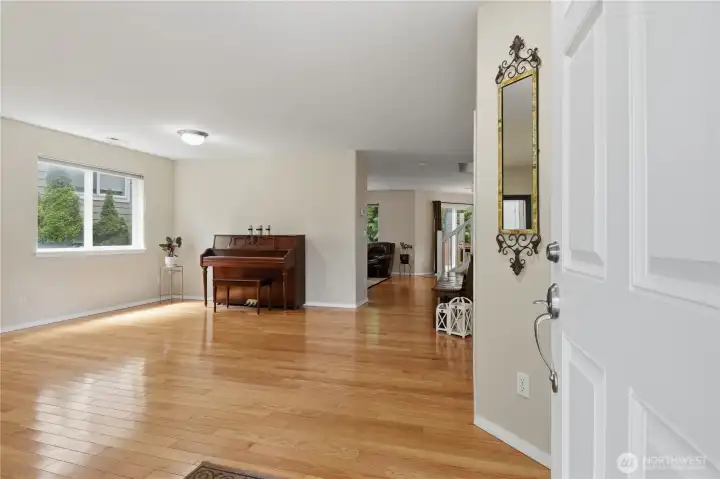 Spacious living room with gorgeous hardwood floors.