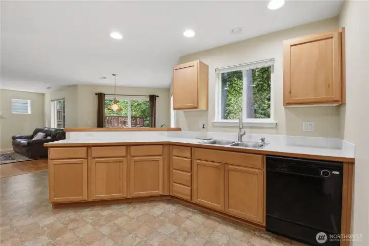 The expansive kitchen has an abundance of cabinets and counter space.
