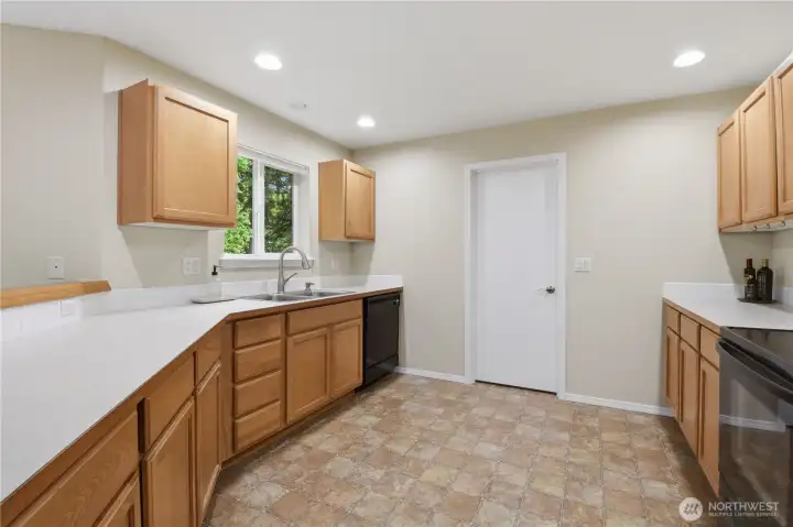 The door leads to the laundry room and a walk-in pantry.