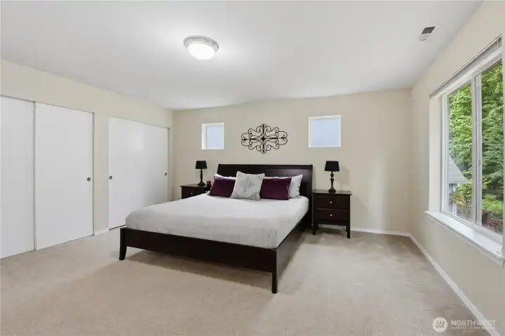The primary suite can comforably accommodate a king sized bed and furniture.
