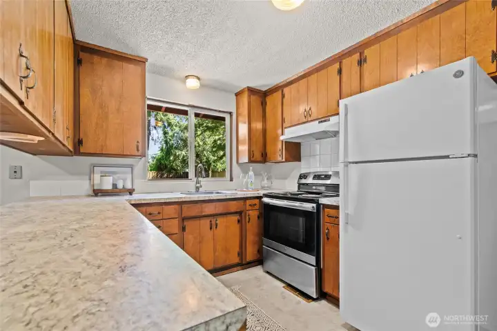 Kitchen space connects to the garage making unloading groceries easy Kitchen space connects to the garage making unloading groceries easy