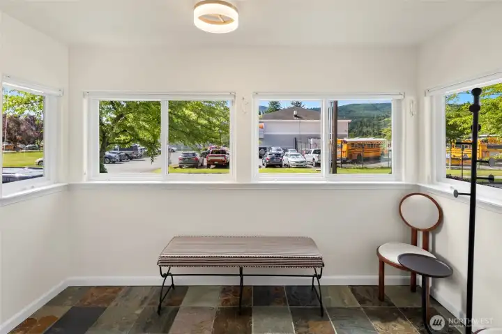 Bright entry offers the perfect spot for a reading nook, mudroom, or plant-filled retreat. Bright entry offers the perfect spot for a reading nook, mudroom, or plant-filled retreat.