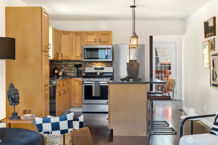 Picture slow mornings with coffee at the island and evenings spent sharing appetizers and conversation in this welcoming kitchen. Picture slow mornings with coffee at the island and evenings spent sharing appetizers and conversation in this welcoming kitchen.