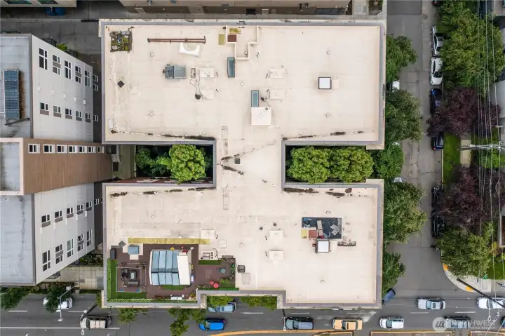 Aerial view of roof. Some units have rooftop access. Aerial view of roof. Some units have rooftop access.
