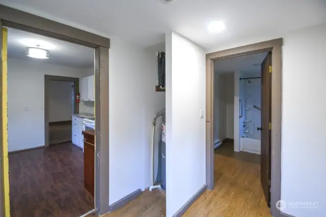 Laundry room looking towards kitchen and bathroom