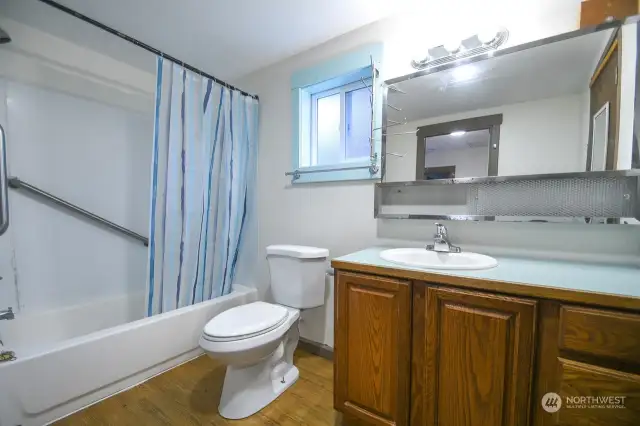 Bathroom with tub and shower