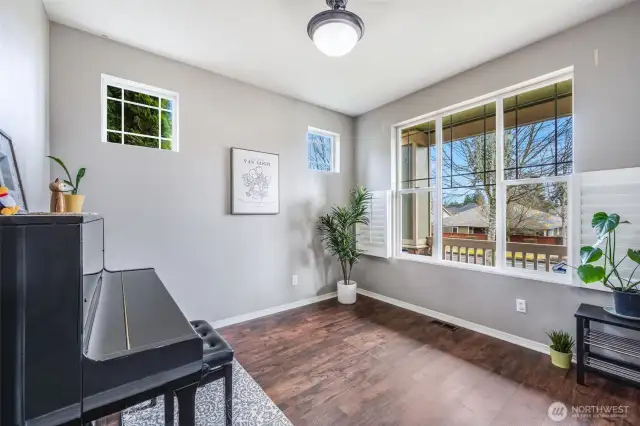 Flooded with natural light, this versatile space offers an open and airy ambiance, perfect for a music room, formal dining, or a cozy sitting area with picturesque views of the front porch.