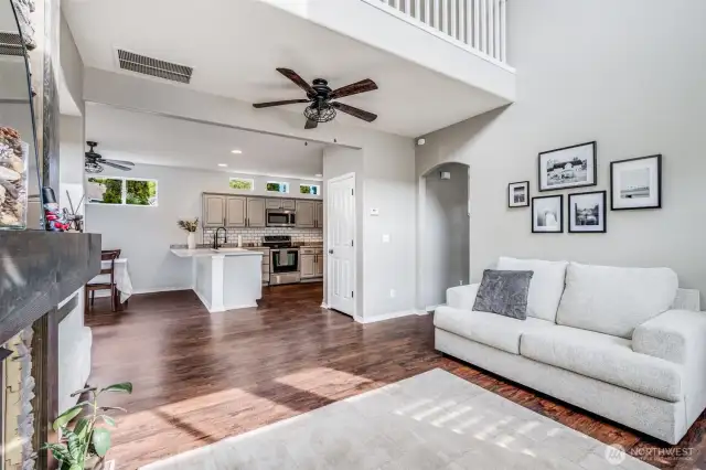 Designed for effortless entertaining, this open-concept layout seamlessly connects the spacious living room to the stylish kitchen, creating a warm and inviting space for gatherings both large and small.