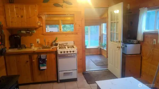 Cabin -The enclosed porch is a sitting area and dining.