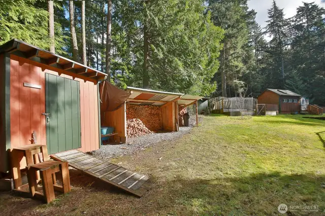Shed and wood and covered wood storage.