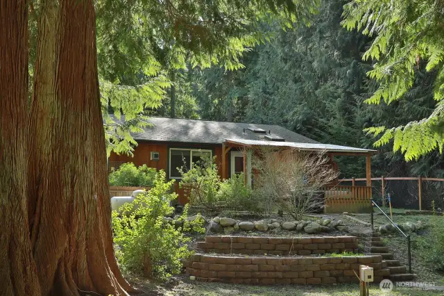 Hot tub has easy access off the Primary.  It's covered so rain or snow you can enjoy! No one can see you..