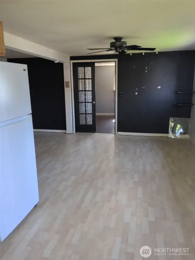 Main living area, double doors lead into bedroom