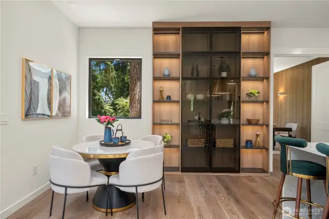 The cozy breakfast nook offers direct access to a charming private deck, perfect for morning coffee or casual meals.
