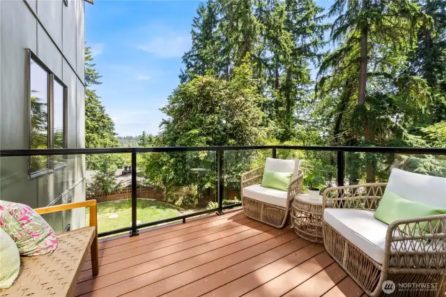 Step out from the sunlit breakfast nook onto a private deck, ideal for enjoying fresh air and peaceful garden views.