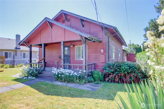Charming Craftsman style with inviting covered front porch and fully fenced yard