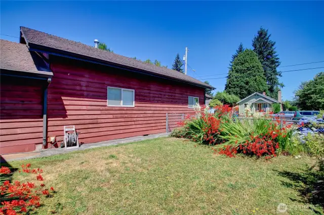 Fully fenced yard with ample space for pets, gardening, or play