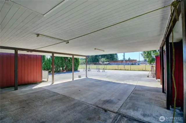 Attached 4 car carport plus two storage sheds - room for all your toys, tools, or gear