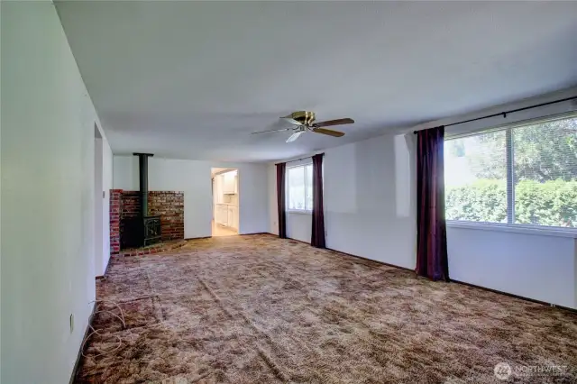 Cozy living area with free-standing gas stove for warmth and ambiance
