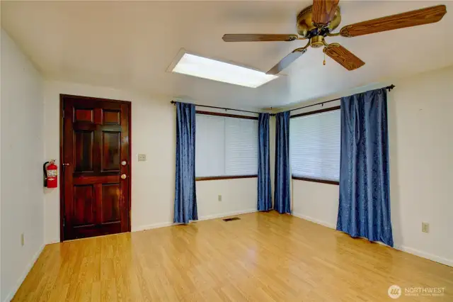 Generous dining space just off the kitchen - great for gatherings or entertaining. Easy access from dining area to 4 cars carport and garage