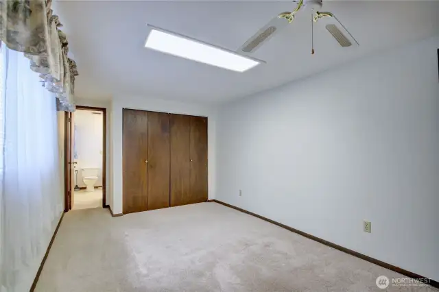 Comfortable primary bedroom with direct access to continental 3/4 bath