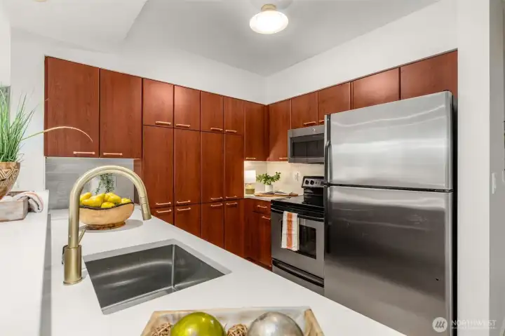 new quartz counters, new sink, new faucet, new lights, new hardware on cabinets