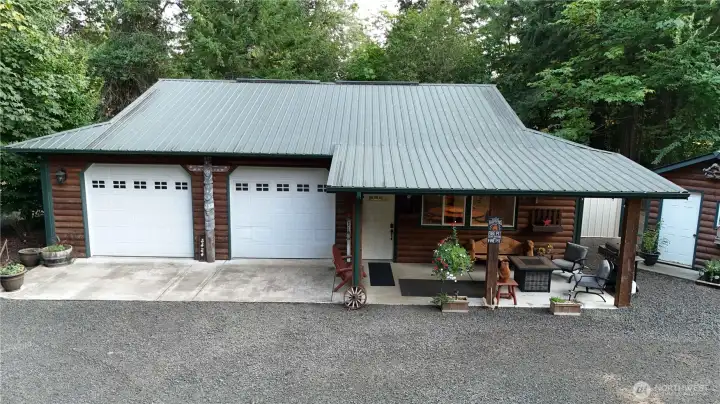 Awesome shop with log accents and metal roof. You have to see inside!