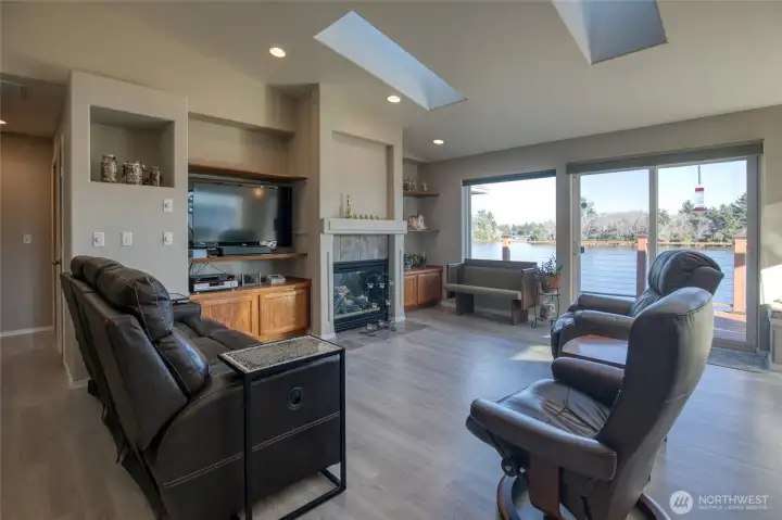 Lots of built-ins in the main livingroom. Above the fireplace is an artistic design in the plaster of mountains.
