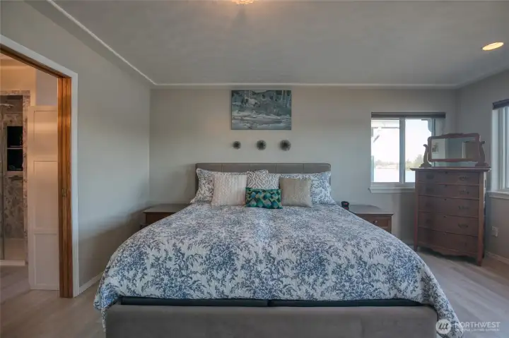 The Primary Suite has an artistic etched ceiling that resembles waves or clouds!