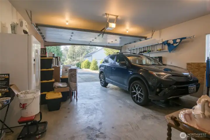 The attached 2 car garage is extra deep for toys! Currently, sellers have extra cabinet storage.