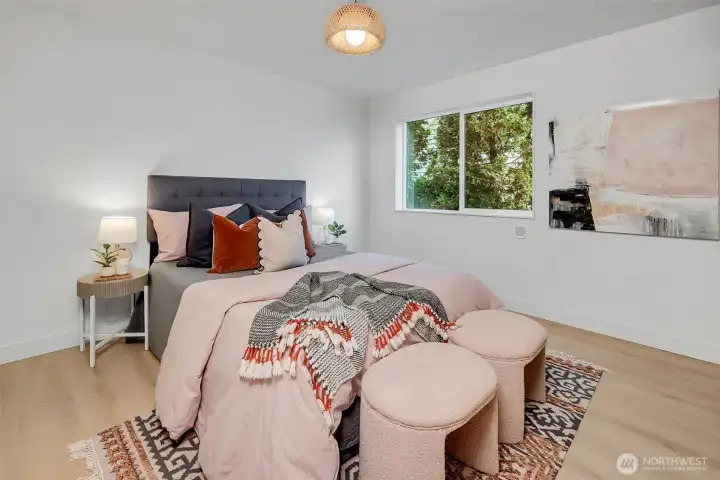 Bright, well-sized second-floor bedroom w/modern design & versatile use options.