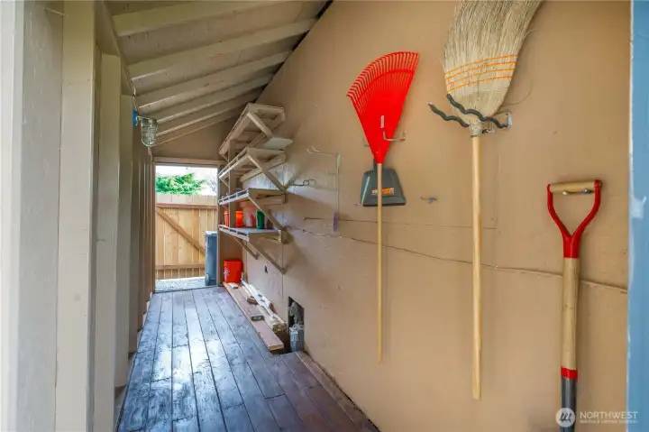 Another view of shed. Convenient passing from the front yard to the back yard.