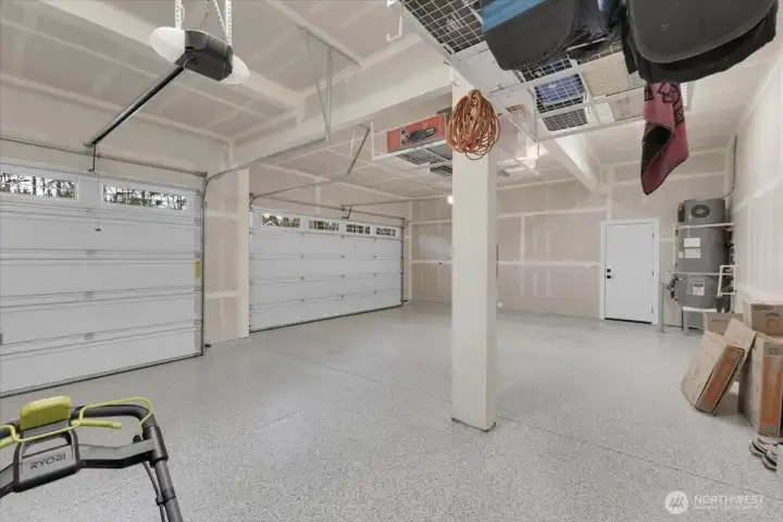 Epoxy Floor and storage above installed in Garage