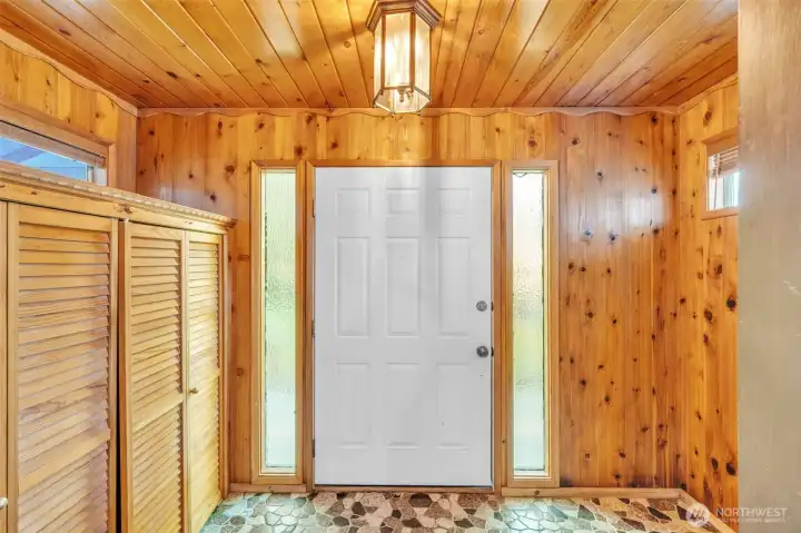 Front door entry hall all in knotty pine