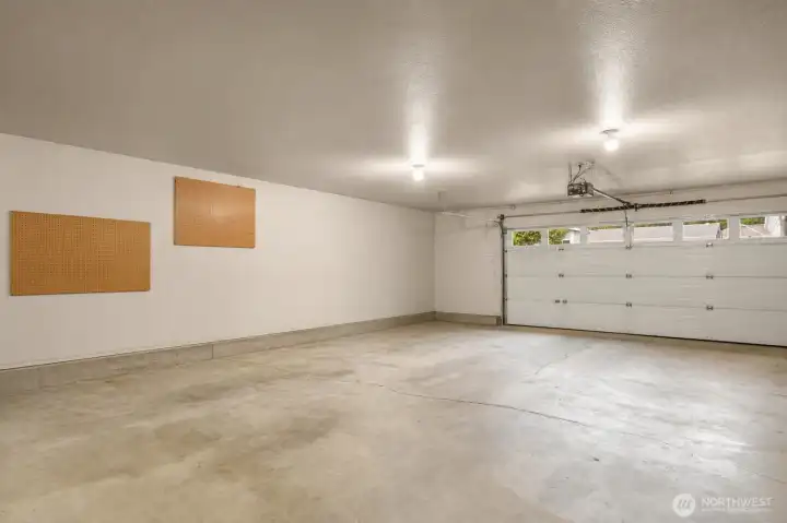 Virtually decluttered large garage.